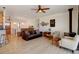 Bright living room with hardwood floors, a wood-burning stove, and stylish furniture, perfect for relaxation and entertaining at 10691 County Road 23, Fort Lupton, CO 80621
