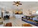 Open living space with light wood floors seamlessly connects to the dining area and kitchen for easy living and entertaining at 10691 County Road 23, Fort Lupton, CO 80621