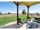 Relaxing patio with outdoor seating and picturesque views of the surrounding landscape at 10691 County Road 23, Fort Lupton, CO 80621