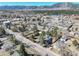 Expansive aerial view featuring the home and neighborhood, complete with mountain views and blue skies at 335 Jefferson St, Monument, CO 80132