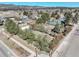 An aerial view of a beautiful landscaped property showcasing the home and surrounding area with mountain views at 335 Jefferson St, Monument, CO 80132