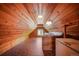 Spacious attic with wood-paneled walls and ceilings, complete with a sink and countertop at 335 Jefferson St, Monument, CO 80132