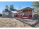 Charming home with a spacious red deck and pergola, perfect for outdoor relaxation and entertaining at 335 Jefferson St, Monument, CO 80132
