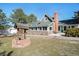 A lovely backyard featuring a wishing well, green lawn and access to the sunroom at 335 Jefferson St, Monument, CO 80132