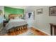 Relaxing bedroom with hardwood floors, and a beautiful green accent wall at 335 Jefferson St, Monument, CO 80132