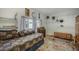 Bright bedroom with carpet flooring, a window, shelving, and a daybed with a floral-patterned rug at 335 Jefferson St, Monument, CO 80132