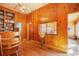 Cozy sunroom with lots of windows, wood paneling and hardwood floors at 335 Jefferson St, Monument, CO 80132