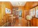 Charming dining room with hardwood floors, wood paneling and lots of natural light at 335 Jefferson St, Monument, CO 80132