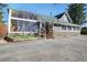 This lovely home includes a unique sunroom, stone accents, and a spacious driveway at 335 Jefferson St, Monument, CO 80132