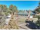 Charming home with a well, mature trees, and wildlife, creating a serene and inviting atmosphere at 335 Jefferson St, Monument, CO 80132