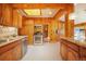 Spacious wood kitchen with stainless appliances, granite countertops and skylight offering an abundance of natural light at 335 Jefferson St, Monument, CO 80132