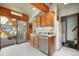 Cozy kitchen with stainless dishwasher, tile backsplash and access to a sunny adjoining room at 335 Jefferson St, Monument, CO 80132