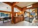 Cozy kitchen with granite counters and wood accents with access to a sunroom and dining room at 335 Jefferson St, Monument, CO 80132