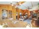 Spacious living room with wood paneling, hardwood floors, and built in bookshelves at 335 Jefferson St, Monument, CO 80132