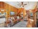 Inviting living room features wood paneling, beamed ceilings and a comfortable seating area at 335 Jefferson St, Monument, CO 80132