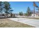Outdoor pickleball court on sunny day, with mountains in the distance, surrounded by mature trees and green space at 335 Jefferson St, Monument, CO 80132