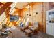 Cozy sunroom with wood walls, stone floors, ceiling fan, and lots of natural light at 335 Jefferson St, Monument, CO 80132