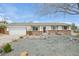 Charming ranch-style home with brick accents and landscaped front yard at 16097 E Cornell Pl, Aurora, CO 80013