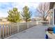 Spacious backyard patio with a white picket fence, perfect for outdoor entertaining or relaxing at 3525 E 139Th Pl, Thornton, CO 80602