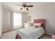 Charming bedroom featuring a single bed, carpet flooring, neutral walls, and a patterned rug at 3525 E 139Th Pl, Thornton, CO 80602