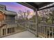Balcony view showcasing a neighborhood with lush trees against a stunning sunset sky at 14399 E Grand Dr # 150, Aurora, CO 80015