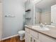 Cozy bathroom with a vanity, sink, and shower behind a shower curtain at 14399 E Grand Dr # 150, Aurora, CO 80015