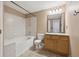 Neutral bathroom featuring a shower-tub combo, a toilet, and a light-wood vanity with a large mirror at 14399 E Grand Dr # 150, Aurora, CO 80015
