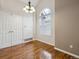 Bright dining area with a large window, hardwood floors, and ample closet space at 14399 E Grand Dr # 150, Aurora, CO 80015