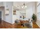 Charming dining area featuring a marble table, stylish chairs, and built-in laundry at 14399 E Grand Dr # 150, Aurora, CO 80015
