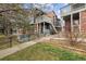 Attractive townhome exterior with brick and siding, plus a small front yard, offers curb appeal at 14399 E Grand Dr # 150, Aurora, CO 80015