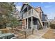 Charming townhome features brick accents, a cozy entryway, and a second-story balcony at 14399 E Grand Dr # 150, Aurora, CO 80015