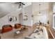 Bright living room with modern decor, hardwood floors, and comfortable seating at 14399 E Grand Dr # 150, Aurora, CO 80015