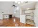 Bright living space with fireplace next to a modern kitchen featuring stainless steel appliances at 14399 E Grand Dr # 150, Aurora, CO 80015