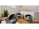 Sitting area featuring modern chairs, a side table, and a dedicated workspace at 14399 E Grand Dr # 150, Aurora, CO 80015