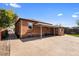 Large backyard with brick house and covered patio at 4747 Shoshone St, Denver, CO 80211