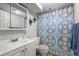 Basement bathroom with shower/tub and patterned curtain at 4747 Shoshone St, Denver, CO 80211