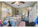 Charming bedroom with ceiling fan and colorful bedding at 4747 Shoshone St, Denver, CO 80211