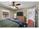 Comfortable bedroom with ceiling fan and access to hallway at 4747 Shoshone St, Denver, CO 80211