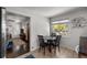 Bright dining area with table and chairs, offering view to living room at 4747 Shoshone St, Denver, CO 80211