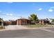 Brick ranch home with a fenced yard and driveway at 4747 Shoshone St, Denver, CO 80211