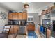 Updated kitchen with wood cabinets and granite countertops at 4747 Shoshone St, Denver, CO 80211