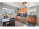 Eat-in kitchen with wood cabinets, granite counters, and a window at 4747 Shoshone St, Denver, CO 80211