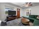 Living room with a sectional sofa and a view of the kitchen at 4747 Shoshone St, Denver, CO 80211