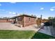 Brick patio with detached garage and seating area at 4747 Shoshone St, Denver, CO 80211