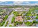 Community aerial view featuring lush greenery, townhomes, and a mix of residential and commercial properties at 10044 Martin Luther King Blvd, Denver, CO 80238