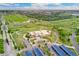 Stunning aerial view showcasing the community with green spaces, solar panels, and mountain views in the background at 10044 Martin Luther King Blvd, Denver, CO 80238
