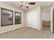 Bedroom with large closet, two windows with shutters, neutral carpet and light walls at 10044 Martin Luther King Blvd, Denver, CO 80238