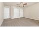 Neutral bedroom with 2 closets, neutral carpet and walls, and ceiling fan at 10044 Martin Luther King Blvd, Denver, CO 80238