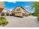 Exterior of the property features a two-car garage, a driveway and lush landscaping at 10044 Martin Luther King Blvd, Denver, CO 80238