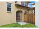 Charming home entrance with a wood gate and decorative security door at 10044 Martin Luther King Blvd, Denver, CO 80238